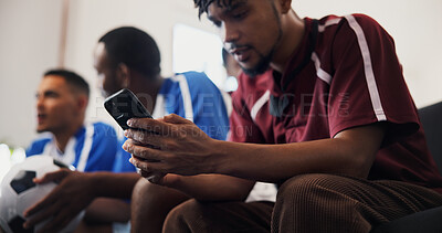 Buy stock photo Hands, phone and watching tv with friends for football, game and texting with streaming service. Men, group and smartphone with scroll, typing and notification on mobile app with soccer fans at home