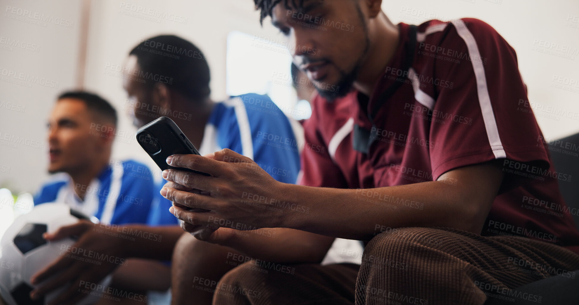 Buy stock photo Hands, phone and watching tv with friends for football, game and texting with streaming service. Men, group and smartphone with scroll, typing and notification on mobile app with soccer fans at home