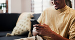 Smile, reading and hands with phone on couch, check social media notification and watch online video. Digital communication, typing and man with mobile in home for message, blog and browsing internet