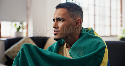 Buy stock photo Man, anxiety and watching tv in home with sports match, concern and suspense for football competition. Person, stress and nervous in lounge with tension, flag and broadcast for soccer world cup game.