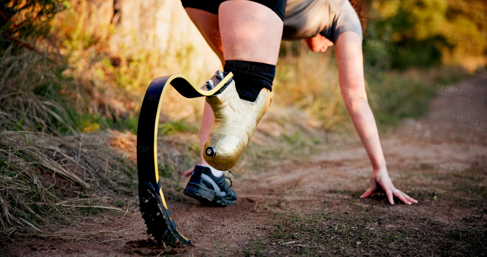 Buy stock photo Woman, start and running with prosthetic leg in nature for sprint, race or outdoor workout on trail. Active, runner or female person with a disability getting ready to begin cardio exercise or launch