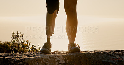 Buy stock photo Athlete, hiking and prosthetic leg on mountain for fitness, adventure and exercise for mobility. Closeup, cliff and person with disability for trekking, physical challenge and rehabilitation training