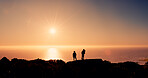 Hiking, sunrise and back of people on mountain with ocean view for adventure, trekking and exercise. Nature, space and friends with horizon in morning for fresh air, wellness and workout for health