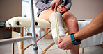 Physiotherapy, measure and person with amputation in clinic for prosthetic leg, support and consulting. Healthcare, measurement and physical therapist with patient with disability for artificial limb