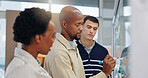 Business people, writing and team with glass board for schedule planning, agenda or tasks in office. Businessman, group or employees taking notes with ideas for company project or brainstorming