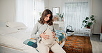 Relax, pregnancy and woman on bed in home with peace, calm or weekend break with maternity leave. Motherhood, stomach and pregnant female person holding belly for prenatal bonding in bedroom at house