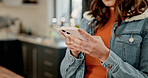 Phone, hands and woman in home for internet search, check forum and article with app in kitchen. Mobile, person and communication in apartment, reading news and blog post with online notification