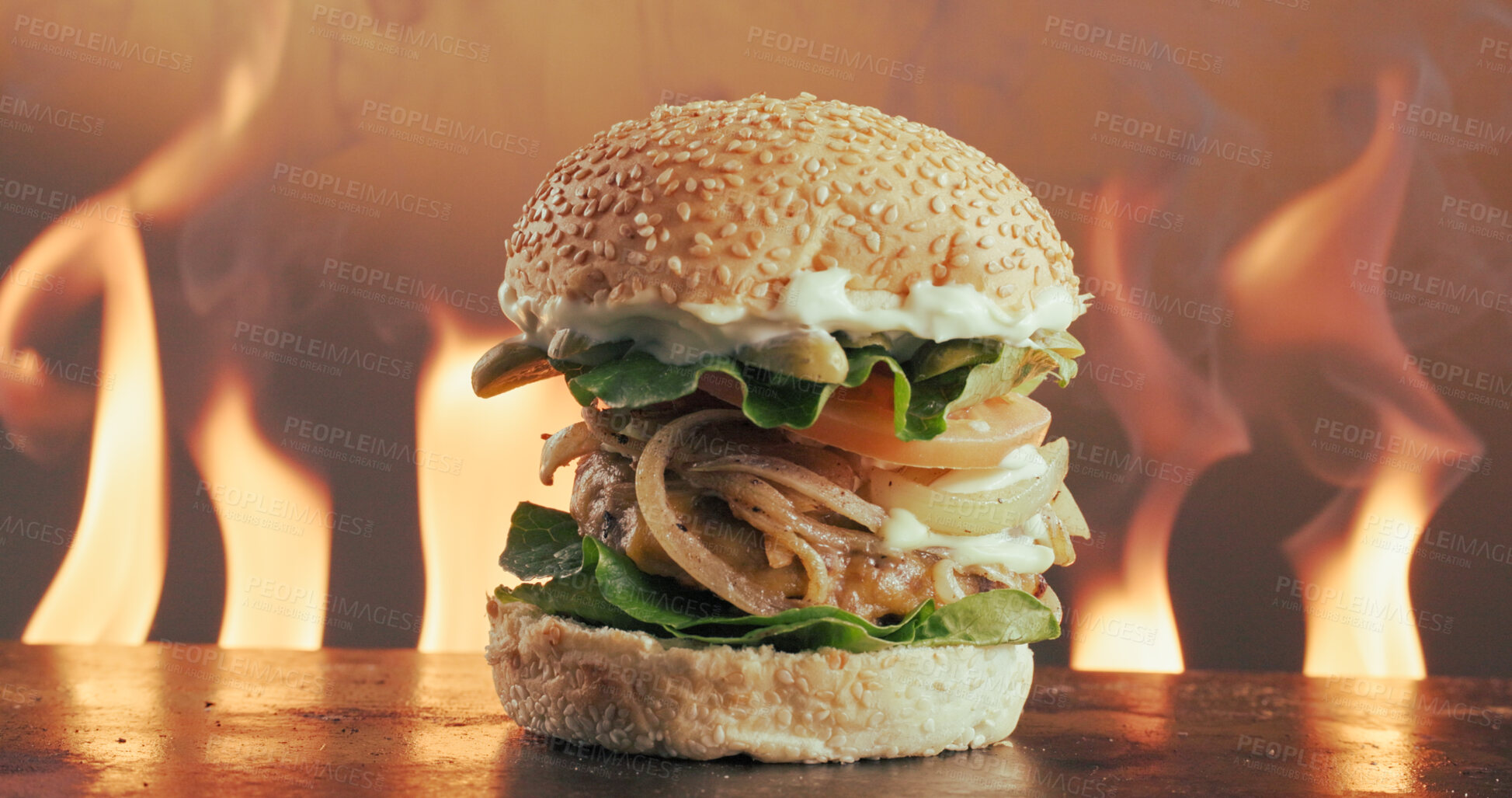 Buy stock photo Flame, grill and hamburger in restaurant with fast food, cuisine serving or catering for lunch dish. Fire, beef and bun in kitchen with seeds, vegetable ingredients and hospitality for takeaway meal.