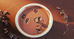 Slab, topping or bowl of chocolate for production, tempering method or gourmet mixture for baking. Above, culinary process or cocoa with garnish for dessert preparation, confectionery or ingredients