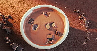 Buy stock photo Slab, topping or bowl of chocolate for production, tempering method or gourmet mixture for baking. Above, culinary process or cocoa with garnish for dessert preparation, confectionery or ingredients