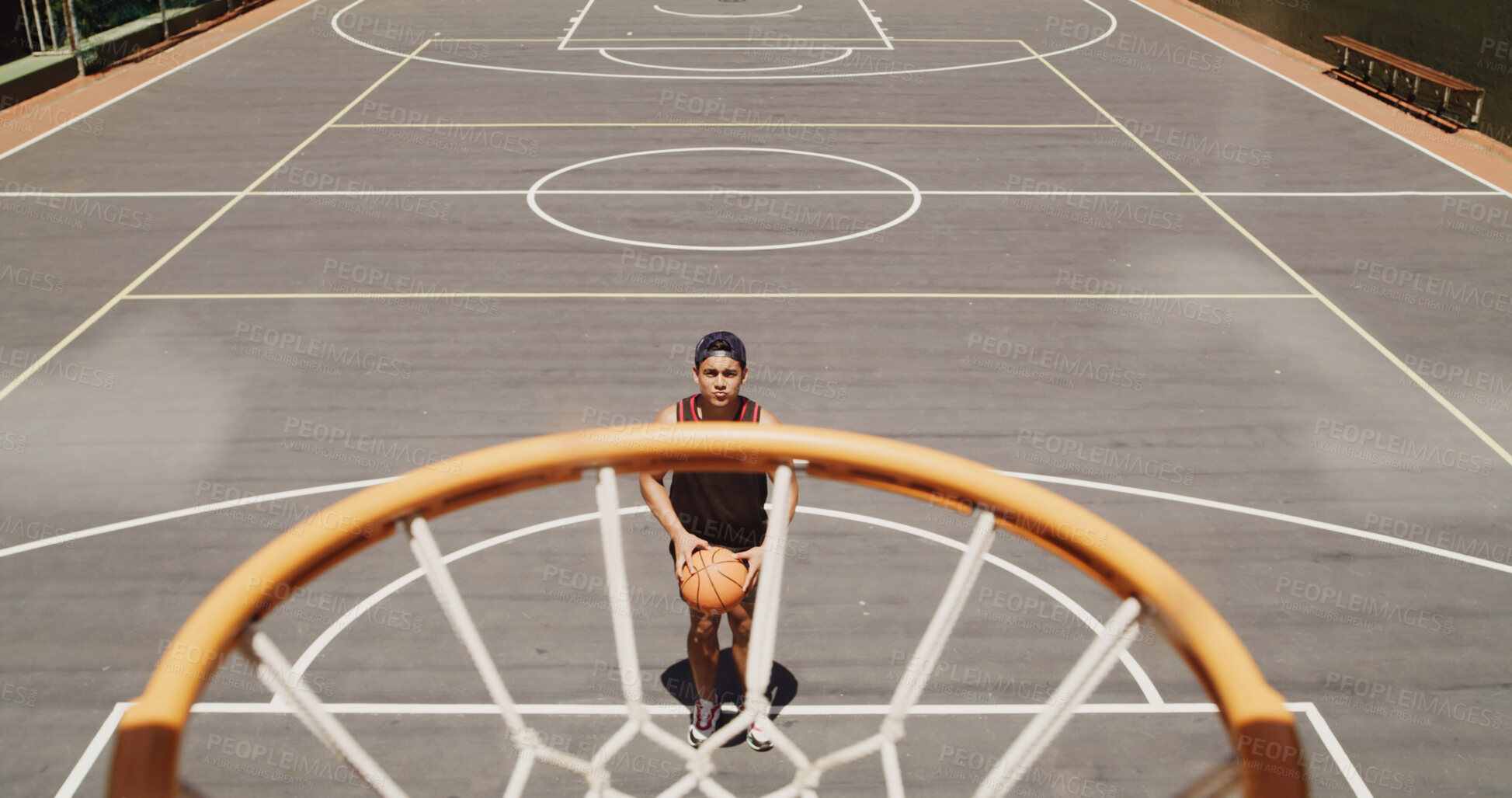 Buy stock photo Aim, basketball and skill with man outdoor for game, practice or shooting technique. Hoop, net and target with athlete person on sports court for match training or scoring attempt from above
