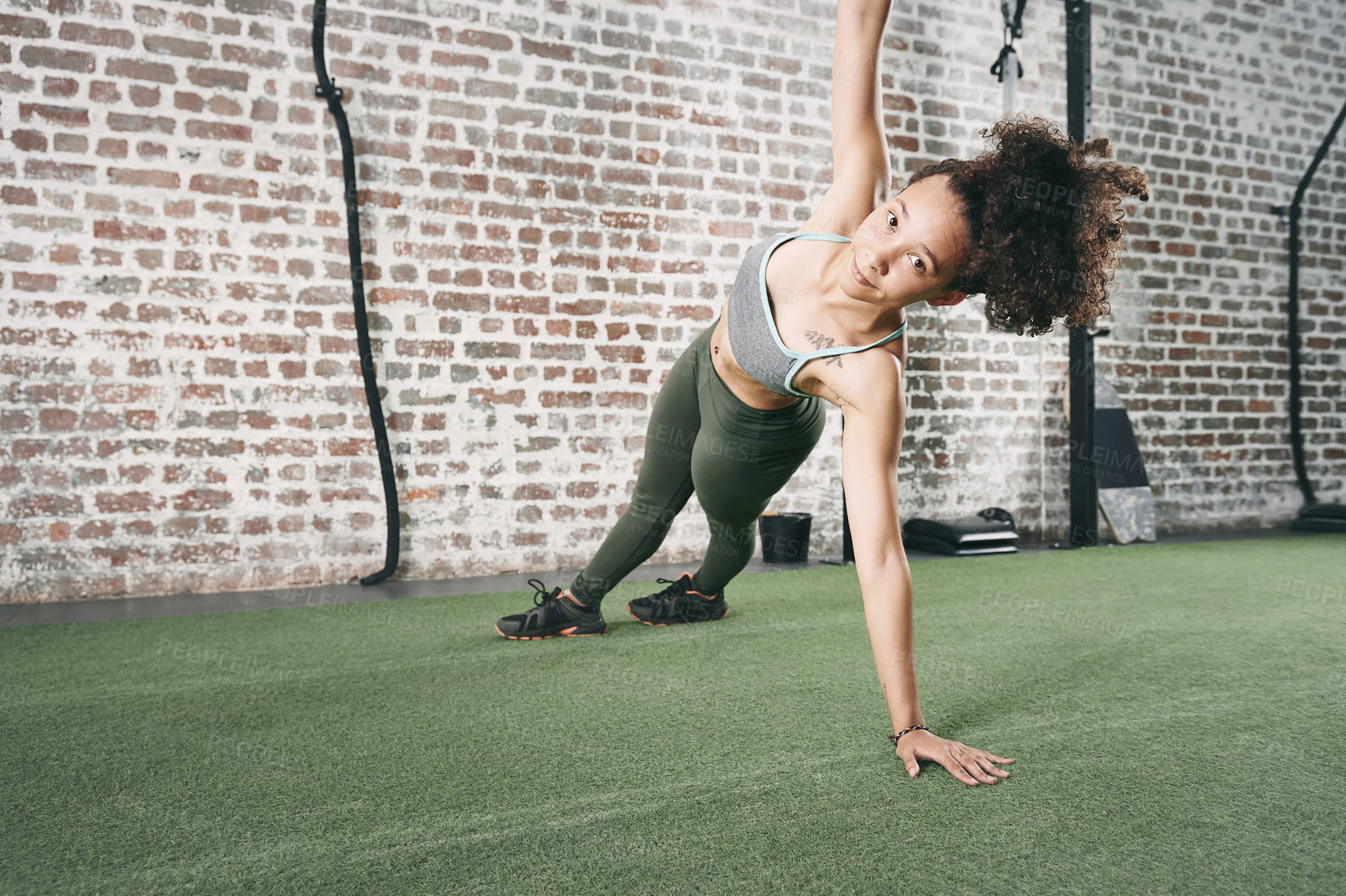 Buy stock photo Side plank, sports and portrait of woman in gym with exercise, training or wellness routine. Health, strong and female athlete with core strength workout, challenge or active in fitness center.