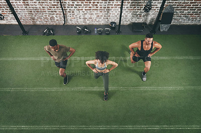 Buy stock photo Group, workout and lunge with personal trainer in gym, wellness or fitness routine for body strength. Health club, balance and people with instructor for exercise, above and stretching together