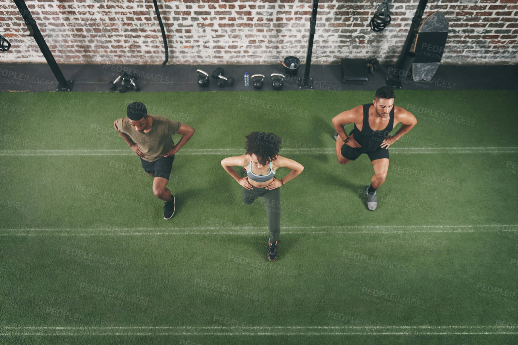 Buy stock photo Group, workout and lunge with personal trainer in gym, wellness or fitness routine for body strength. Health club, balance and people with instructor for exercise, above and stretching together