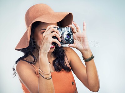 Buy stock photo Camera, photography and woman in studio for vacation, sightseeing or weekend trip with fashion. Happy, dslr equipment and female person with stylish outfit for summer holiday by white background.