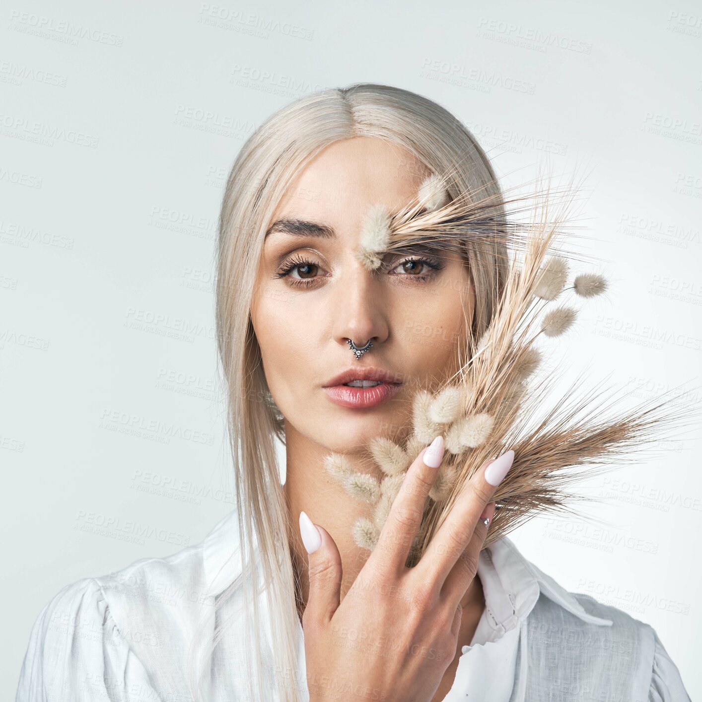 Buy stock photo Studio, beauty or woman with wheat for art, natural aesthetic or organic on white background. Plants, creative or serious person with cosmetic, bunny tail grass or portrait with sustainable skincare