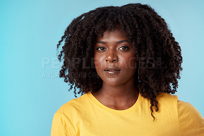 Buy stock photo Curly, hair and portrait of black woman in studio with pride for natural growth, texture and maintenance. Beauty, salon and person with hairstyle for health, wellness and cosmetics on blue background