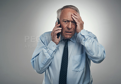 Buy stock photo Phone call, financial advisor and man in studio, stress and frustrated on gray background. Mature person, mobile user and investor with cellphone, angry and talking to contact, confused and bad news