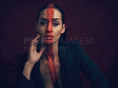 Buy stock photo Serious, woman and fashion with paint in studio for culture, sacred and tribal identity. Portrait, female person and artistic symbol for resistance, tradition and self expression on black background