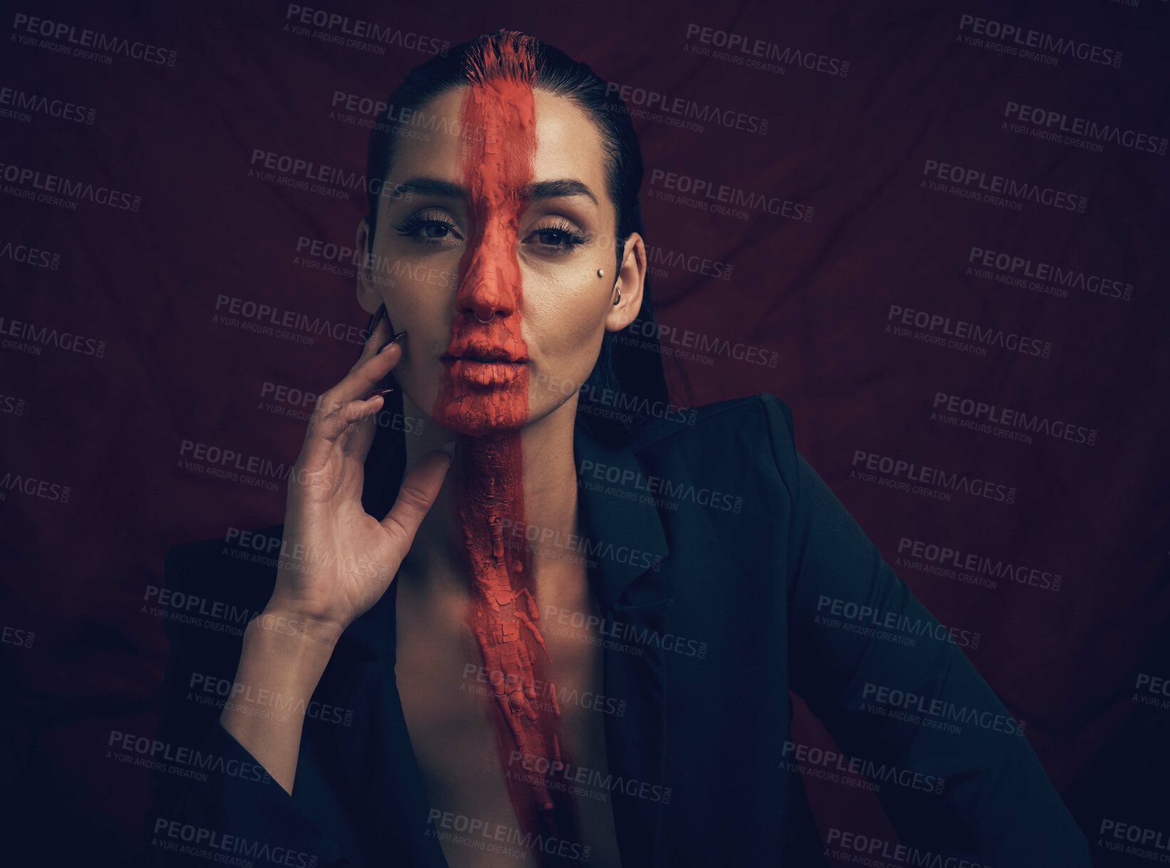 Buy stock photo Serious, woman and fashion with paint in studio for culture, sacred and tribal identity. Portrait, female person and artistic symbol for resistance, tradition and self expression on black background