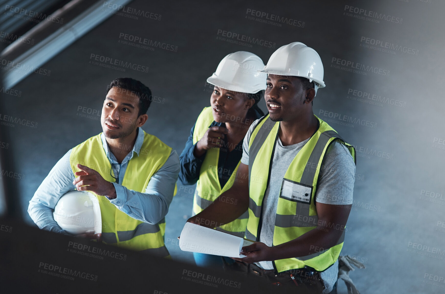 Buy stock photo Business people, pointing and building team with helmet in warehouse for structure improvement. Group, employees or contractors checking storage quality or inspection for construction or development