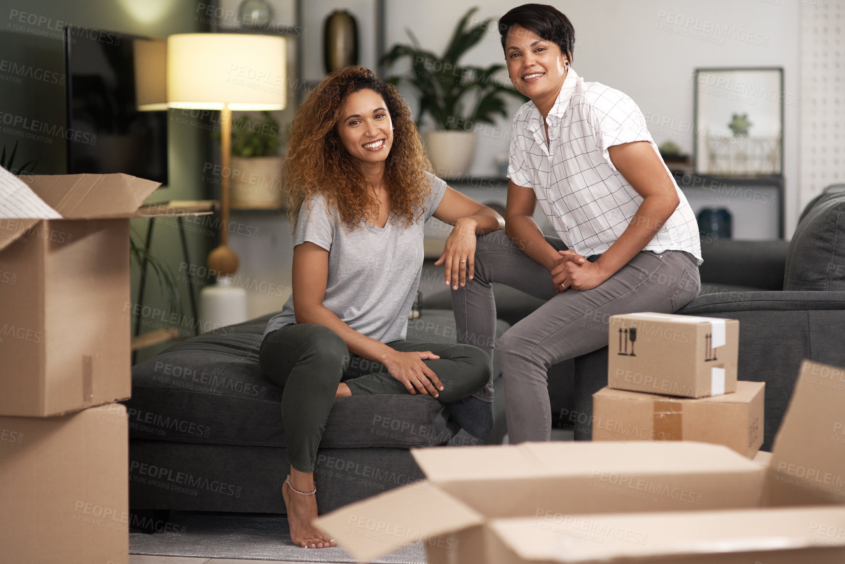 Buy stock photo Boxes, new home and portrait of lesbian couple in bedroom together for growth, love or mortgage. Moving house, property and smile of gay women in apartment for bonding or real estate investment