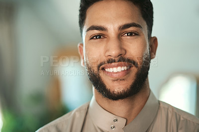 Buy stock photo Religious, portrait and Muslim man with smile in home, relax and confident with traditional clothes. Culture, space and person with thobe for Islamic faith, peace and happiness on break in house