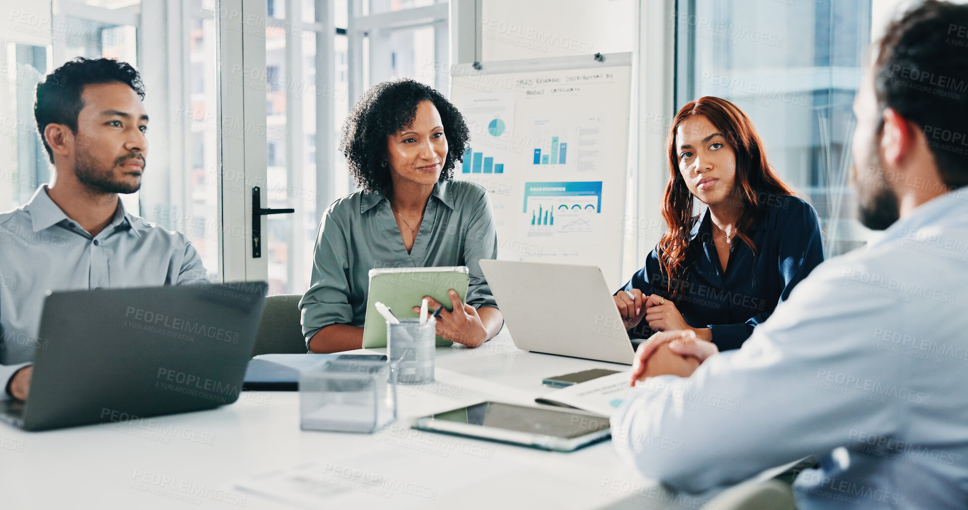 Buy stock photo Business people, laptop and discussion at office meeting with tablet, notes and review at insurance company. Women, men and group with feedback, insight or planning at risk management team at agency