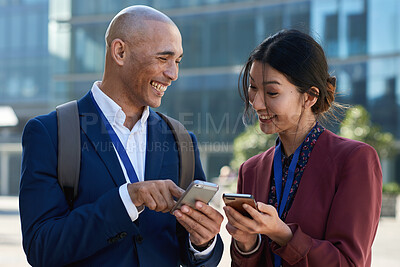 Buy stock photo Business, funny and people in city, cellphone for social media and laughing with communication. Outdoor, employees and online humor with discussion, internet and smartphone for website info and smile