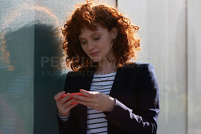 Buy stock photo Phone, city and business woman with online videos for social media, internet and connection on break. Intern, creative worker and person on smartphone for website, message and notification in town