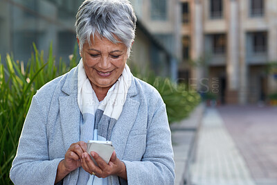 Buy stock photo Phone, mature and business woman in city for social media, internet and connection on break. Happy, professional and person on smartphone for online chat, message and email notification in town