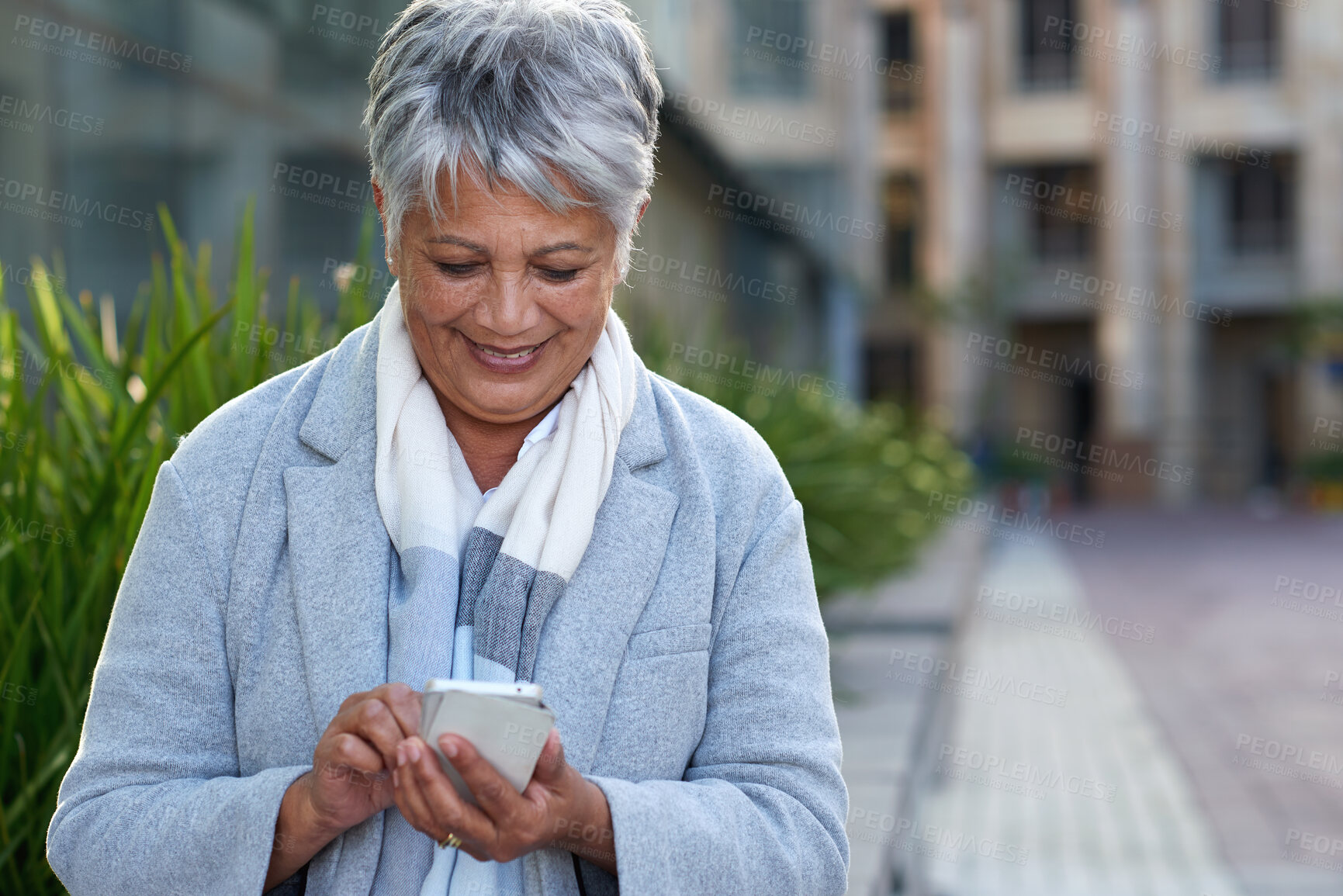 Buy stock photo Phone, mature and business woman in city for social media, internet and connection on break. Happy, professional and person on smartphone for online chat, message and email notification in town