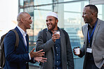 Businessmen friends talking having conversation in city holding coffee