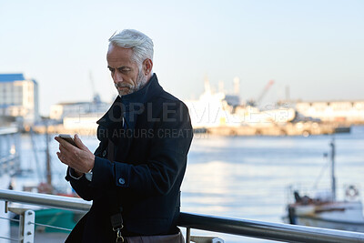 Buy stock photo Businessman, phone and outdoor on balcony with sea, email or job opportunity for international company. Space, mature person and scroll on terrace with tech, ocean or online vacancy for overseas work