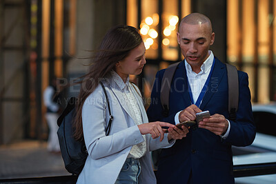 Buy stock photo Business people, night and cellphone in city, conversation and digital app for social media. Outdoor, man or woman with smartphone, evening or connection for communication, talking or online reading