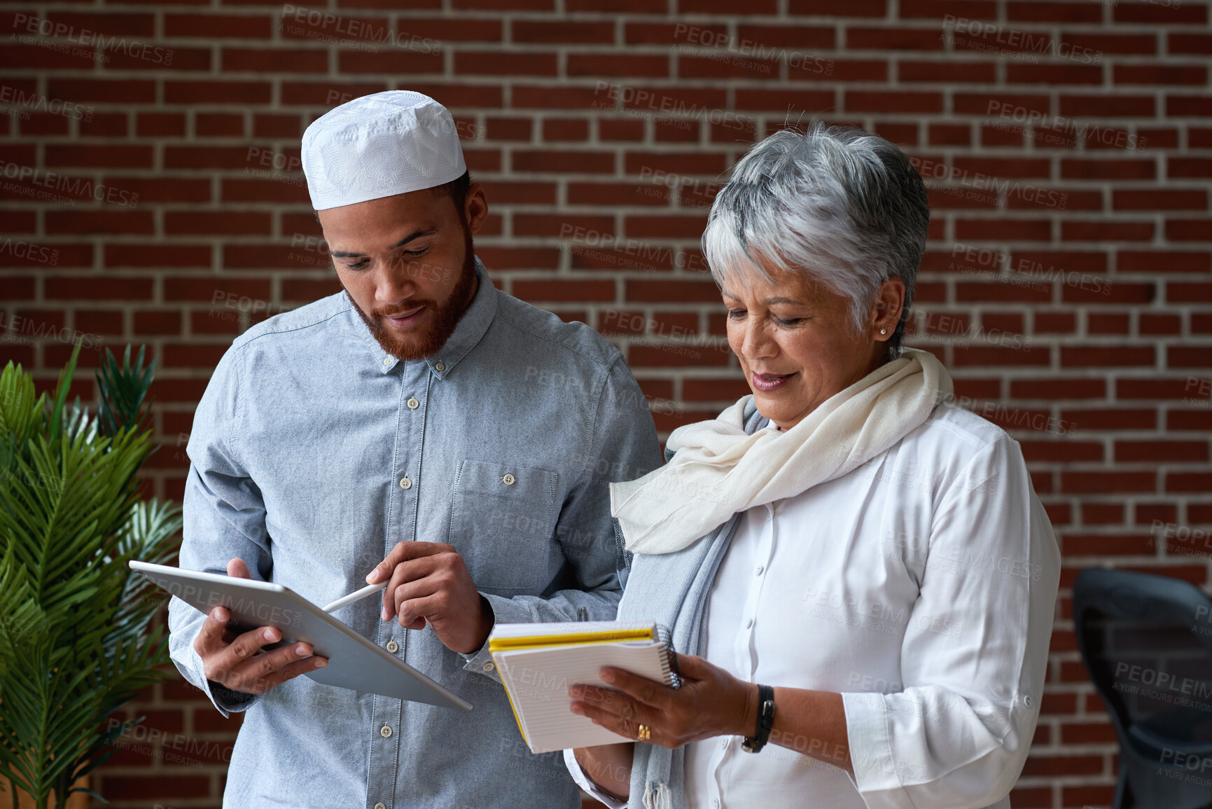 Buy stock photo Creative, people and meeting with tablet in office for research, planning or copywriting report. Team, review or digital with notebook for feedback, fact check and writing notes for story publication