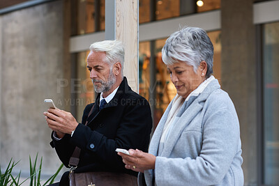 Buy stock photo Waiting, business people and chat with smartphone in city, search and scroll trip price on taxi web. Outdoor, texting and sharing location with cab for commute, mature man and woman with mobile app