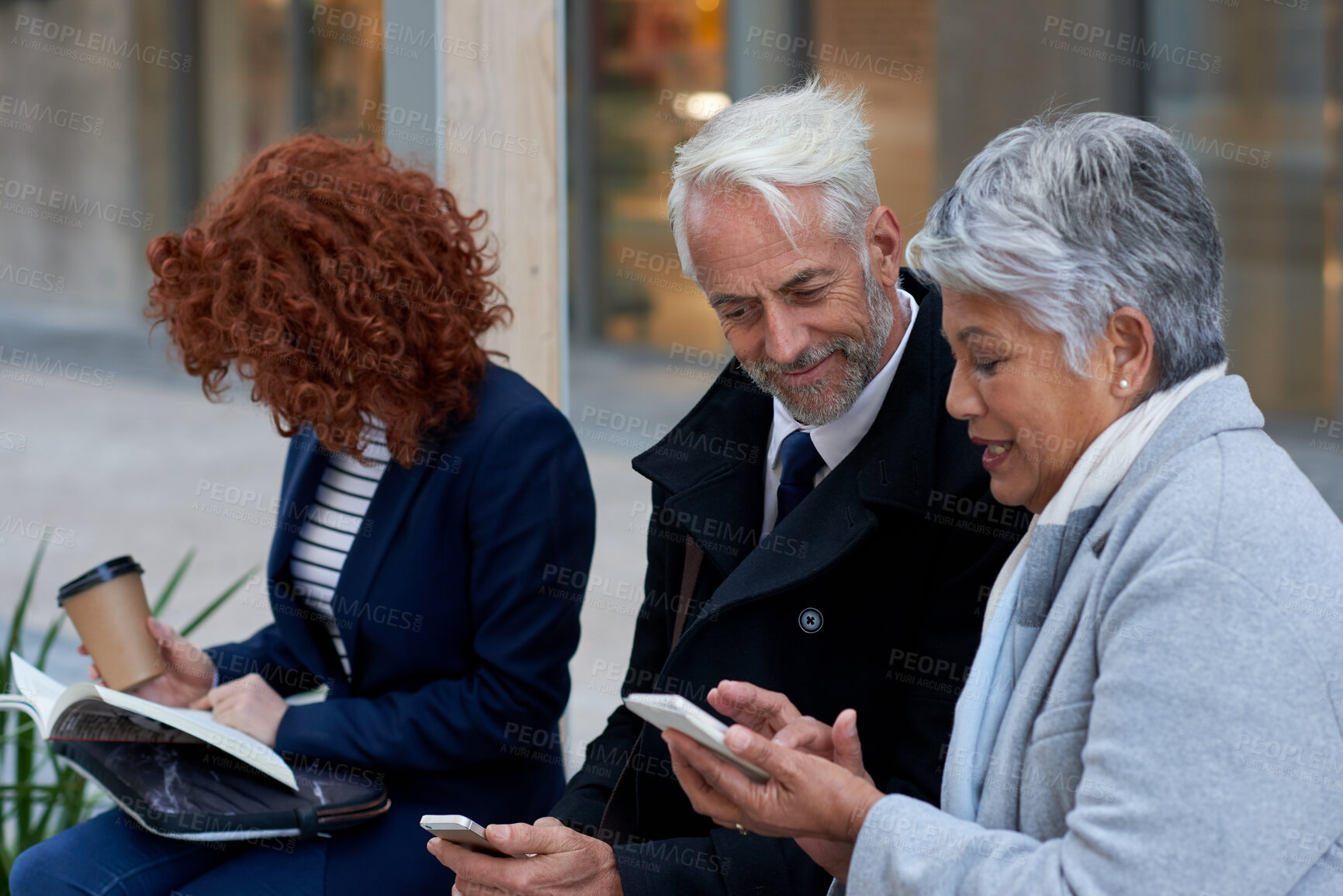 Buy stock photo Employees, discussion and people in city, smartphone for social media or digital app with communication. Outdoor, professional or online reading with smile, talking and cellphone for website info