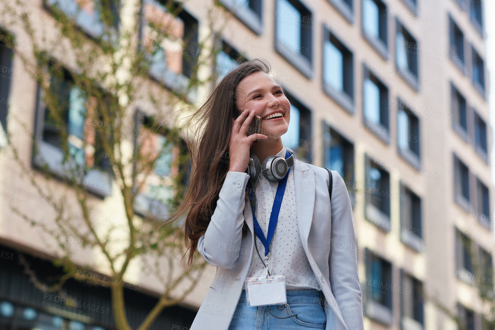 Buy stock photo Phone call, happiness and woman in city, talking and digital app for communication. Outdoor, smile and person in street, smartphone and funny with chatting, travel and discussion with humor or below