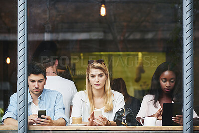 Buy stock photo Coffee shop, relax and people at window with tech, thinking and check post on social media website. Cafe, man and women with mobile tablet for text, networking online and customers chill on weekend