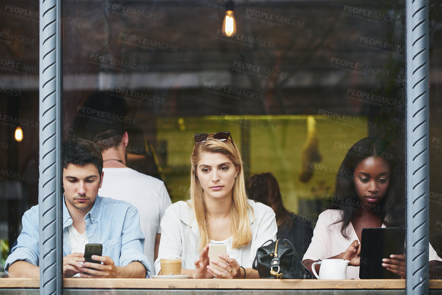 Buy stock photo Coffee shop, relax and people at window with tech, thinking and check post on social media website. Cafe, man and women with mobile tablet for text, networking online and customers chill on weekend
