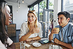 Happy, friends and group with coffee in cafe, talking and bonding with drinks on weekend or hangout. Shop, people and chat with beverage on break, together and smile for reunion and social gathering