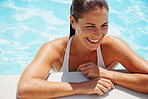 Attractive woman at edge of swimming pool