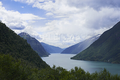 Buy stock photo Mountain, lake and landscape in nature for travel, holiday destination and eco tourism location. Water, snow and glacial valley outdoor for natural beauty, scenic environment and vacation in Norway