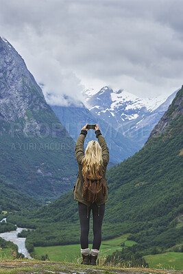Buy stock photo Mountain, hiking and woman with phone screen for picture, online and memory of adventure on website. Outdoor, backpacking and person with mobile for photography, travel vlog or mockup space in nature