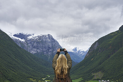 Buy stock photo Mountain, backpacking and woman with phone screen for picture, online and memory of adventure on web. Outdoor, hiking and person with mobile for photography, travel vlog and mockup space in nature