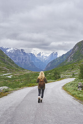 Buy stock photo Mountain, backpacking and woman on road for adventure, mockup space and fresh air on journey or travel. Outdoor, person and hiking on weekend, exploration and trekking with view of valley and scenery