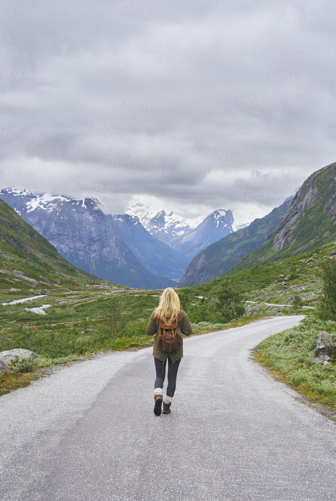 Buy stock photo Mountain, backpacking and woman on road for adventure, mockup space and fresh air on journey or travel. Outdoor, person and hiking on weekend, exploration and trekking with view of valley and scenery