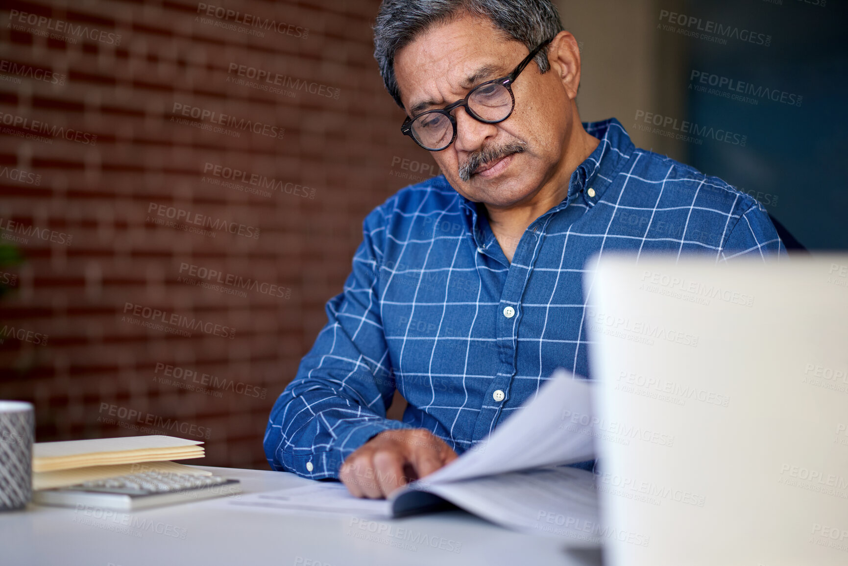 Buy stock photo Accounting, document and man in office with review, tax check or evaluation of budget. Reading, paper or mature financial consultant with admin, company audit or bookkeeping in revenue management.