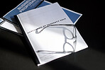 business documents for property sale contract paperwork on desk in office with glasses